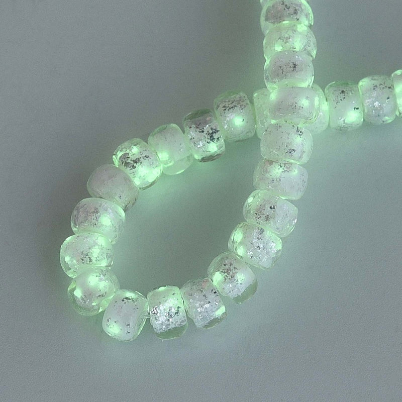 Glaspärla, silverfoilerad självlysande rondell, vit, 1 sträng (13780)