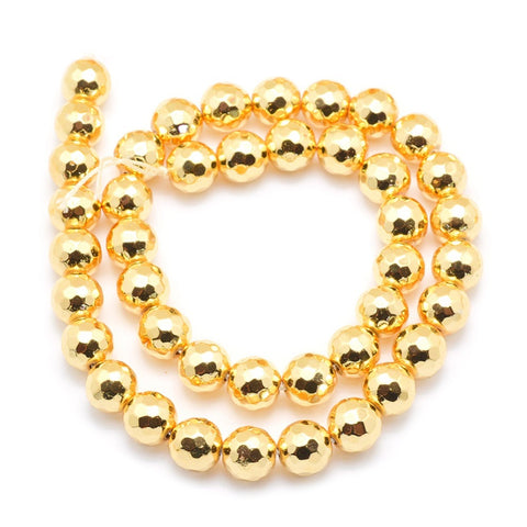 13899 Hematit syntetisk facetterad rund 6 mm, guld, 1 sträng