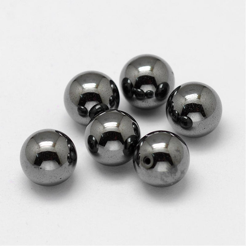 Syntetisk hematit pärla 10 mm, halvborrad, 2st (14443)