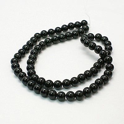 12318 Mashan Jade. Rund. 4 mm. Svart. 1 sträng