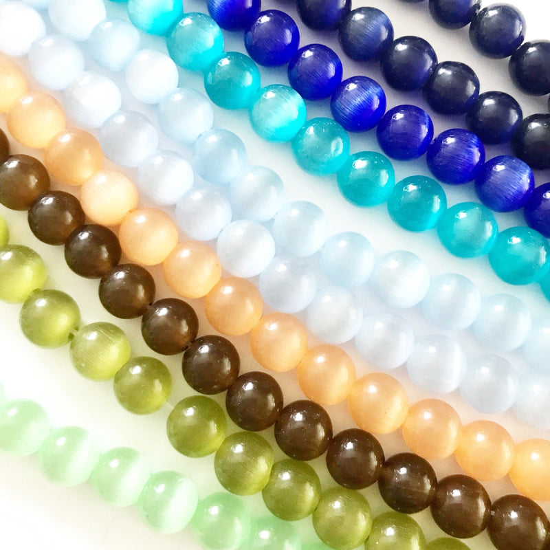 12179 Cats eye 4 mm. 1 sträng. Färgval.